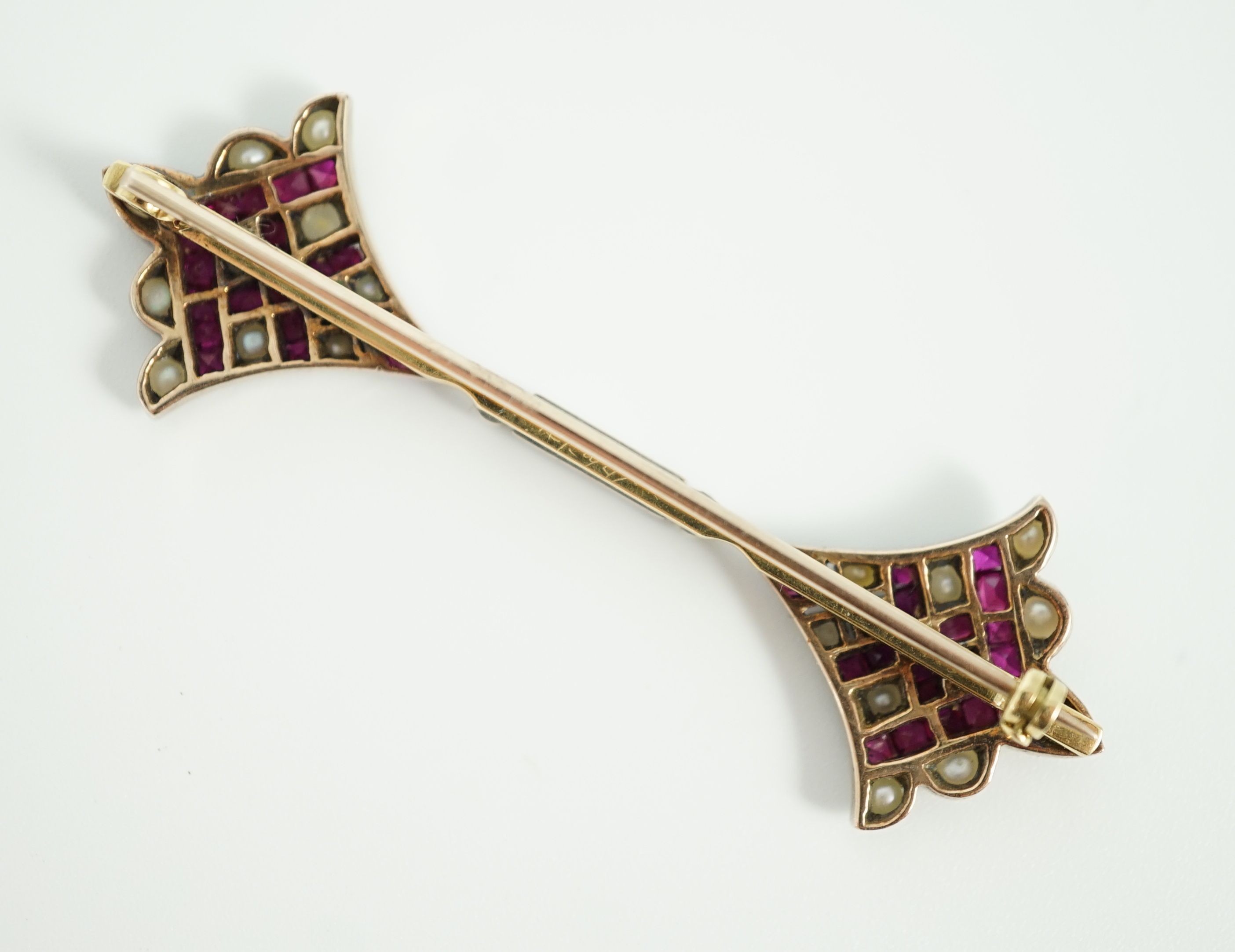 An early 20th century, gold, platinum, ruby and seed pearl set brooch